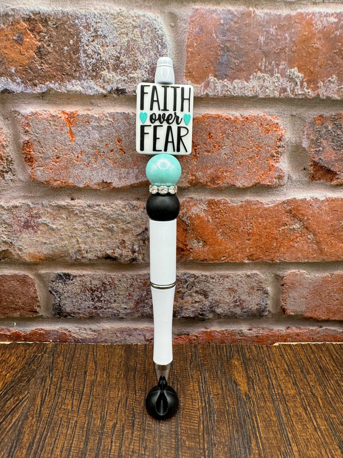 Faith over fear , white and teal pen