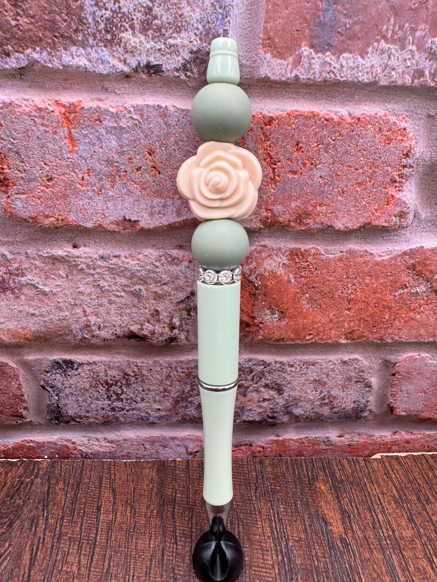 Light green and tan rose bloom pen
